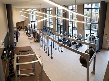fitness center with cardio equipment & free weights
